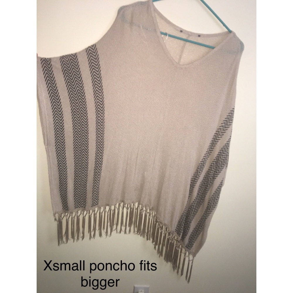 Beige/ black striped poncho.